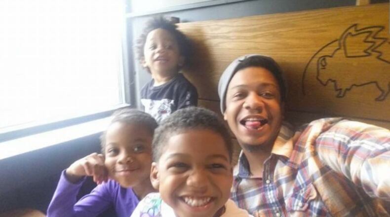 Daniel Wise, 31, was shot and killed Saturday during a custody exchange. He is pictured with his three children.