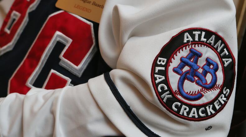 James “Red” Moore wears a Negro League’s Atlanta Black Crackers uniform while talking about his experience at his Atlanta home on Wednesday May 29th, 2013. Seventy-five years ago, Moore helped bring what is believed to be the first professional baseball championship to Atlanta. Now, at the age of 95, Moore has many stories to tell about his days in the Negro League and the state of baseball today, which although has been integrated since 1947 is seeing a diminished amount of African-American players breaking through. PHIL SKINNER / PSKINNER@AJC.COM editor’s note: CQ
