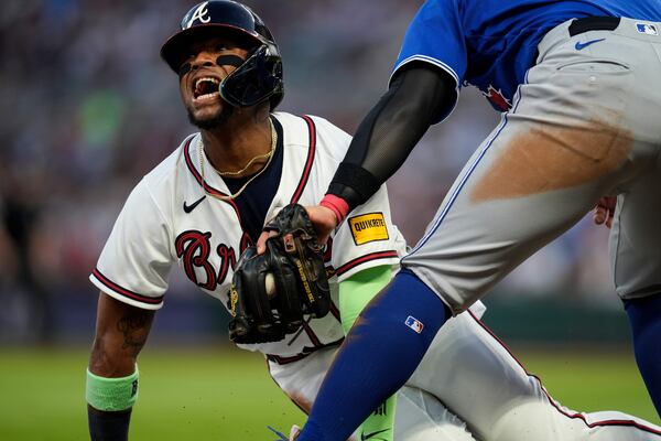 Ronald Acuña Jr. steals third base against the Blue Jays back in June. (Mike Stewart/AP)