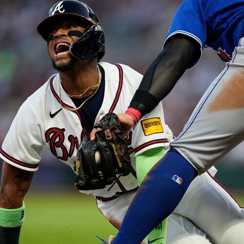 FILE - Atlanta Braves' Ronald Acuña Jr. (13) steals third base against Toronto Blue Jays third baseman Kazuma Okamoto (7) in the fifth inning of a baseball game on June 3, 2026, in Atlanta. (AP Photo/Mike Stewart, File)