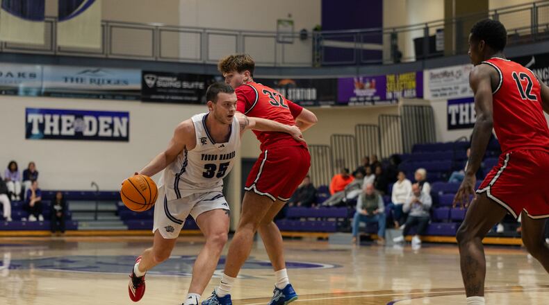 Carl Cleveland (left), a senior at Young Harris College, is the school’s all-time leading scorer. His inside-outside game makes him a tough player to defend. (Courtesy of Curtis Markham)
