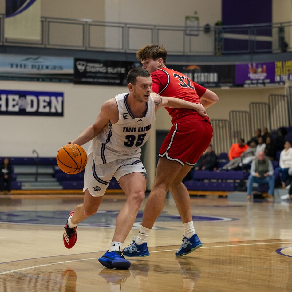 Carl Cleveland (left), a senior at Young Harris College, is the school’s all-time leading scorer. His inside-outside game makes him a tough player to defend. (Courtesy of Curtis Markham)