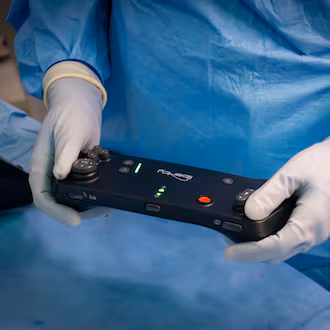 Emory interventional radiologists use a controller to treat medical conditions that looks like a videogame operator. (Courtesy of Winship Cancer Institute of Emory University)
