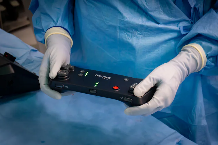 Emory interventional radiologists use a controller that looks like a video game operator to treat medical conditions. (Courtesy of Winship Cancer Institute of Emory University)