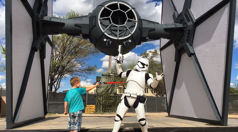 Jaden McClellan pretends to fight with a Star Wars storm trooper at SXSW 2016. The photo opportunity was part of a promotional event for the home video release of "Star Wars: The Force Awakens."