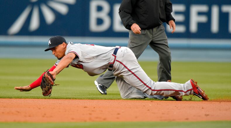 Braves second baseman Jace Peterson makes a catch on a ground ball hit by Los Angeles Dodgers’ Jimmy Rollins during the first inning of a baseball game, Tuesday, May 26, 2015, in Los Angeles. Rollins was safe at first on the play. (AP Photo/Mark J. Terrill)