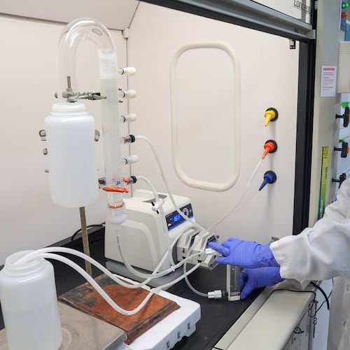 FILE - Stephanie Stoll starts a pump as part of an experiment studying the removal of PFAS from water samples, April 10, 2024, at a U.S. Environmental Protection Agency lab in Cincinnati. (AP Photo/Joshua A. Bickel, File)