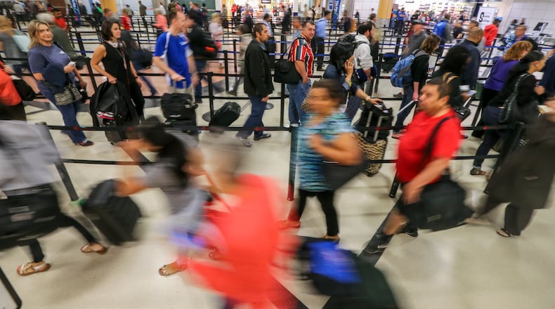 SECONDARY PHOTO - May 16, 2016 Atlanta: Security screening lines up to an hour long or more snaked through the terminal and around baggage claim carousels at Hartsfield-Jackson International Airport early Monday morning, May 16, 2016. Lines for Transportation Security Administration checkpoints have been particularly long for more than a week amid the closure of the Terminal South checkpoint for a redesign of two security lanes aimed at speeding screening. The checkpoint is expected to reopen May 24. In the domestic terminal, the Main checkpoint and Terminal North checkpoint are now handling the huge volumes of passengers that come to the airport. Monday mornings are often the busiest time of the week. JOHN SPINK / JSPINK@AJC.COM