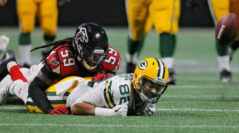Atlanta Falcons linebacker De'Vondre Campbell breaks up a second half pass intended for Green Bay Packers tight end Richard Rodgers .  Atlanta Falcons vs Green Bay Packers.   The Falcons opened the roof for the Falcons season opener at Mecedes-Benz Stadium.   BOB ANDRES  /BANDRES@AJC.COM