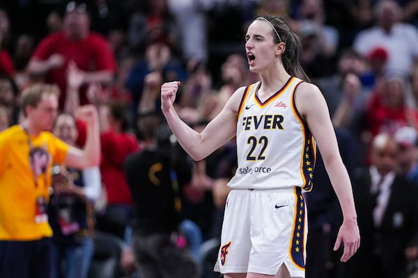 Indiana Fever guard Caitlin Clark (22) reacts after a basket against the New York Liberty in the second half of a WNBA basketball game in Indianapolis, Saturday, May 24, 2025. (AP Photo/Michael Conroy)