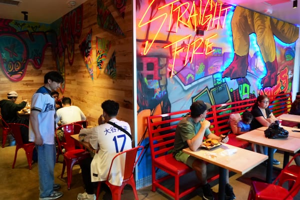 Customers eat inside Dave's Hot Chicken restaurant in the Little Tokyo district of Los Angeles Monday, June 2, 2025. (AP Photo/Damian Dovarganes)