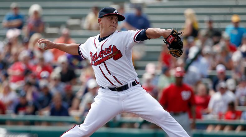 Atlanta Braves starting pitcher Kris Medlen (54) throws in the first inning of a spring exhibition baseball game against the Washington Nationals, Tuesday, March 4, 2014, in Kissimmee, Fla.