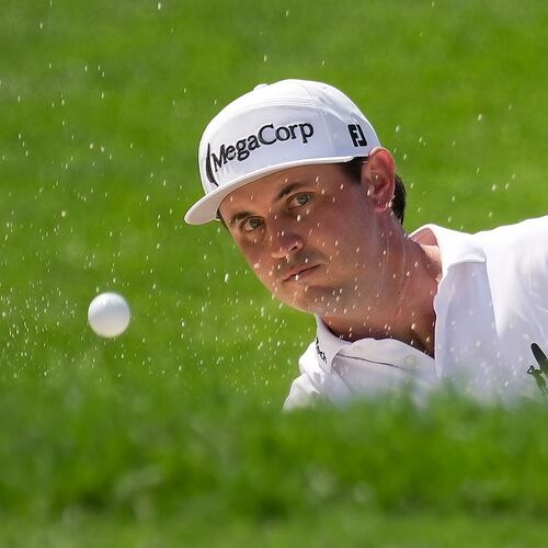 J.T. Poston hits from a bunker to the 18th green during the second round of the Memorial golf tournament in Dublin, Ohio, Friday, June 5, 2026. (AP Photo/Sue Ogrocki)