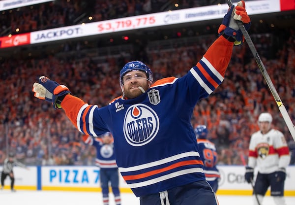 Edmonton Oilers' Leon Draisaitl (29) celebrates his game-winning goal against the Florida Panthers in the first overtime period in Game 1 of the NHL Stanley Cup final in Edmonton, Aberta, Wednesday, June 4, 2025. (Jason Franson/The Canadian Press via AP)
