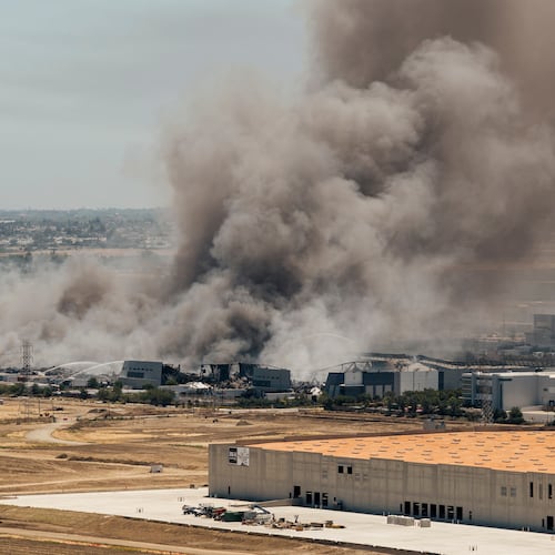 Smoke is seen from the massive fire at the Medline medical supply warehouse in Tracy, Calif., Friday, June 12, 2026. (Stephen Lam/San Francisco Chronicle via AP)