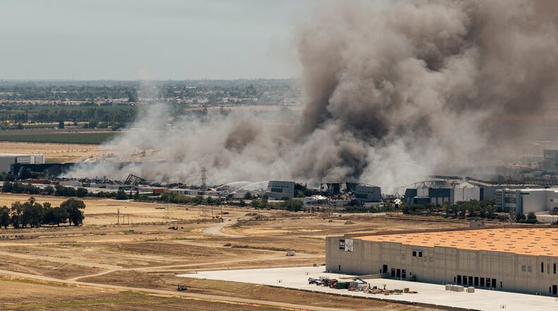 Smoke is seen from the massive fire at the Medline medical supply warehouse in Tracy, Calif., Friday, June 12, 2026. (Stephen Lam/San Francisco Chronicle via AP)