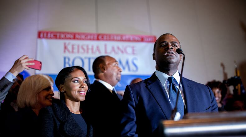 Kasim Reed introduces Atlanta mayoral candidate Keisha Lance Bottoms, who is claiming victory over Mary Norwood, during a runoff election night party at the Hyatt Regency Hotel, Tuesday, Dec. 5, 2017, in Atlanta.  BRANDEN CAMP/SPECIAL