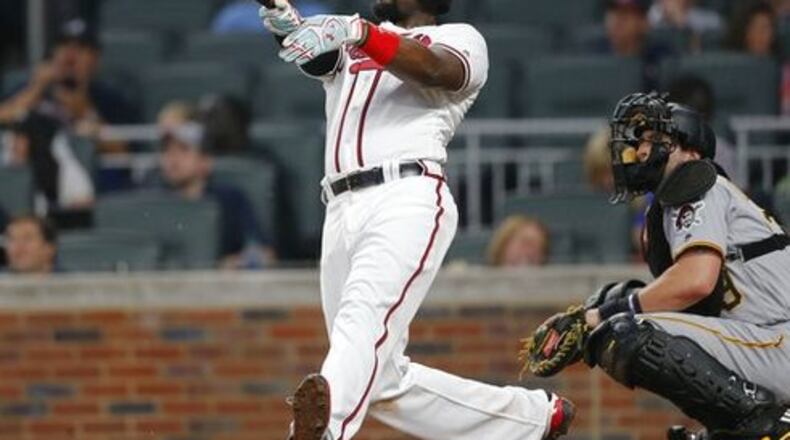 Brandon Phillips follows through on his third-inning home run Monday, the 200th of his career. (AP photo)