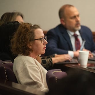 Former Brunswick Judicial Circuit District Attorney Jackie Johnson listens during opening statements in her criminal trial Tuesday afternoon at the Glynn County Courthouse.