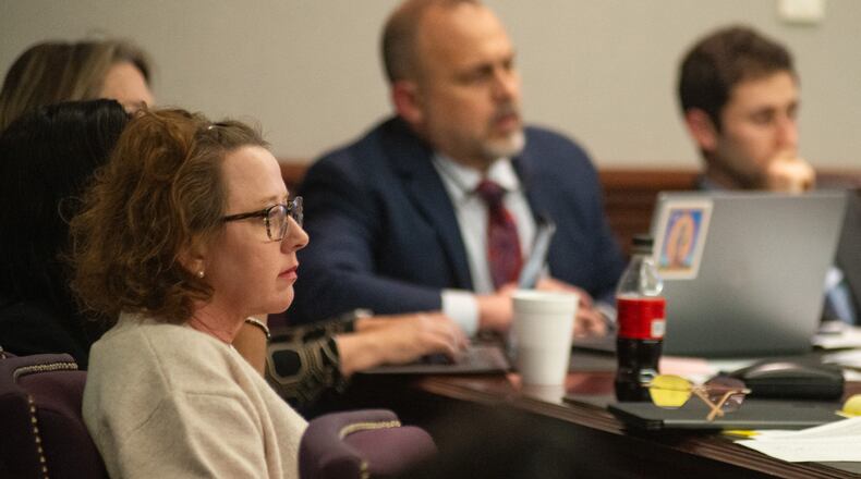 Former Brunswick Judicial Circuit District Attorney Jackie Johnson listens during opening statements in her criminal trial Tuesday afternoon at the Glynn County Courthouse.