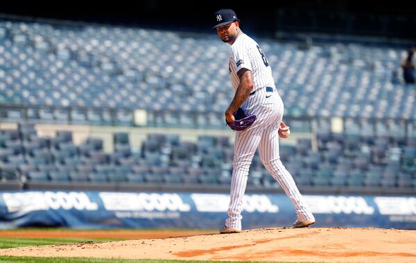 New York Yankees' Luis Gil looks to first before throwing during live batting practice before a baseball game between the New York Yankees and the Baltimore Orioles, Saturday, June 21, 2025, in New York. (AP Photo/Noah K. Murray)