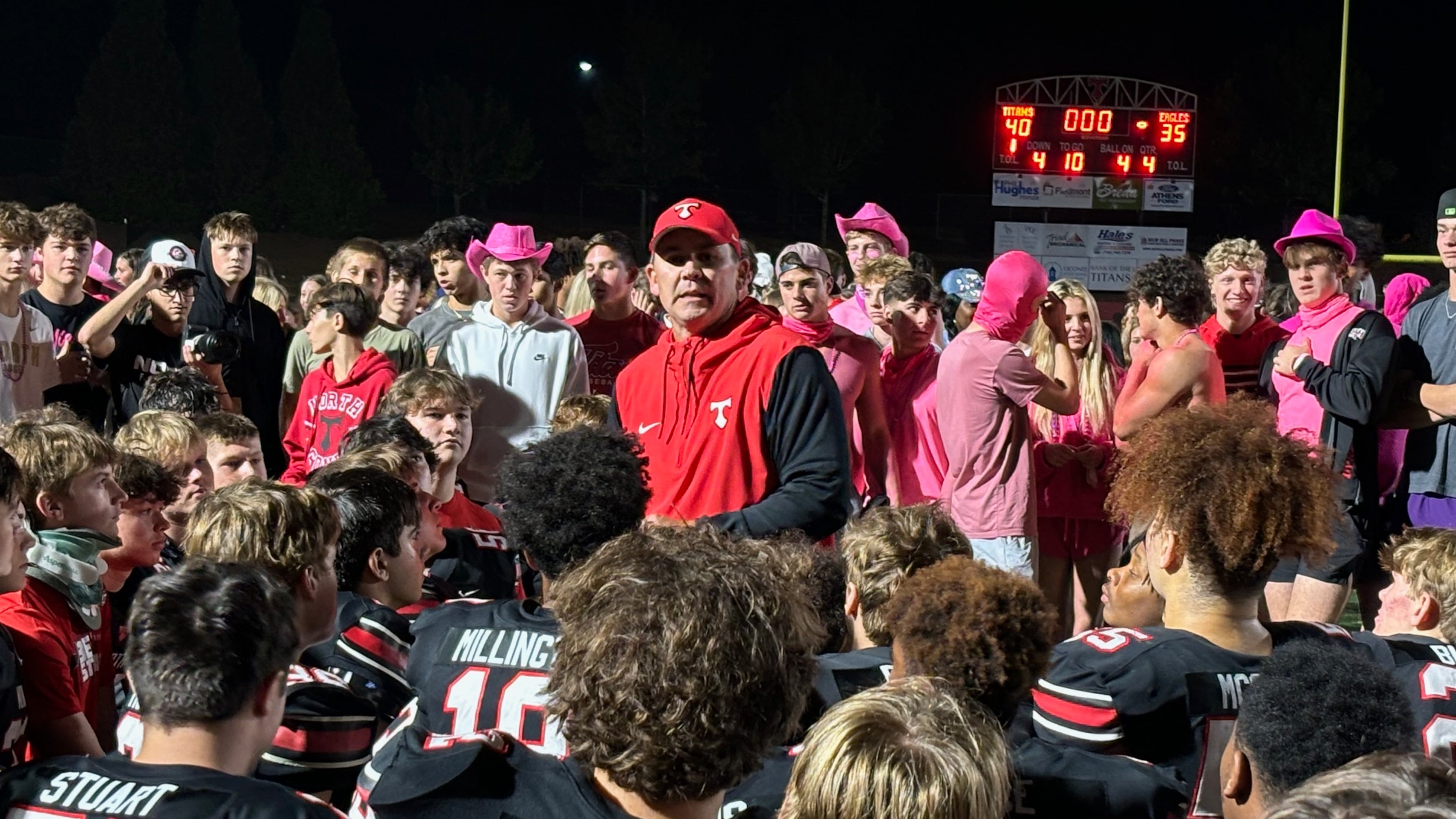 Tyler Aurandt, shown here speaking with his players after their 40-35 win over Eastside last year, became North Oconee’s coach in 2017 following an 0-10 season. (Stan Awtrey for the AJC 2024)