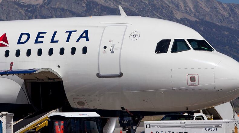 A Delta Air Lines Airbus A319 sits on the tarmac at the Jackson Hole airport in Jackson Hole, Wyoming, U.S., on Wednesday, Aug. 25, 2010.