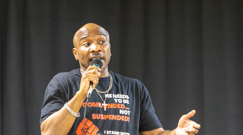Kenneth Miller, who was suspended from Tri-Cities High School after an altercation with a student, speaks at a rally attended by his supporters on March 17, 2022. (Jenni Girtman/AJC FILE PHOTO)