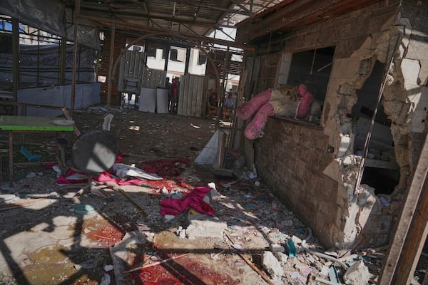 Blood, rubble, and what appears to be a giant stuffed doll lie scattered in a café after it was hit by an Israeli airstrike that killed more than 30 people near the port in Gaza City, Monday, June 30, 2025. (AP Photo/Jehad Alshrafi)