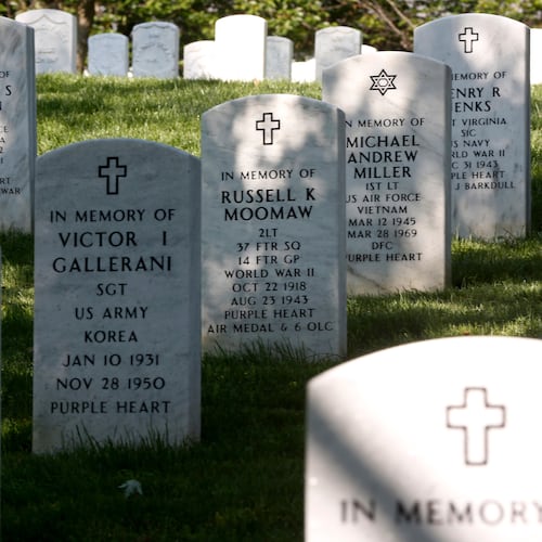 FILE - Rows of gravestones stand at the Arlington National Cemetery in Arlington, Va., May 13, 2014. (AP Photo/Charles Dharapak, File)