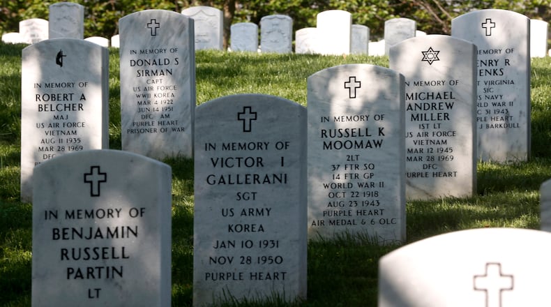 FILE - Rows of gravestones stand at the Arlington National Cemetery in Arlington, Va., May 13, 2014. (AP Photo/Charles Dharapak, File)