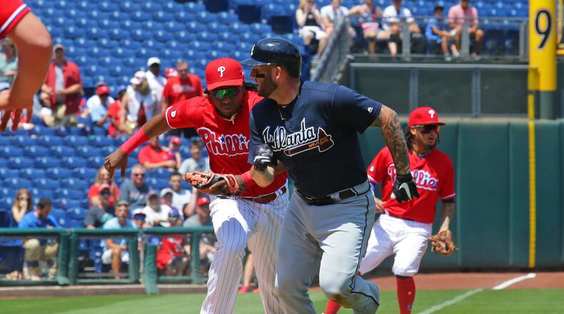 Maikel Franco of the Phillies tags out Matt Adams of the Braves in a run down play in the second inning of Monday's game in Philadelphia.