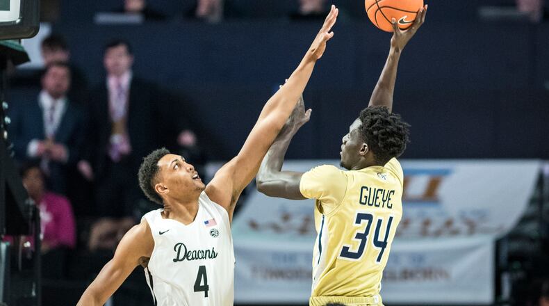 Georgia Tech forward Abdoulaye Gueye (34) shoots over defense from Wake Forest center Doral Moore (4) during an NCAA college basketball game, Wednesday, Feb. 14, 2018 in Winston-Salem, N.C. (Andrew Dye/The Winston-Salem Journal via AP)