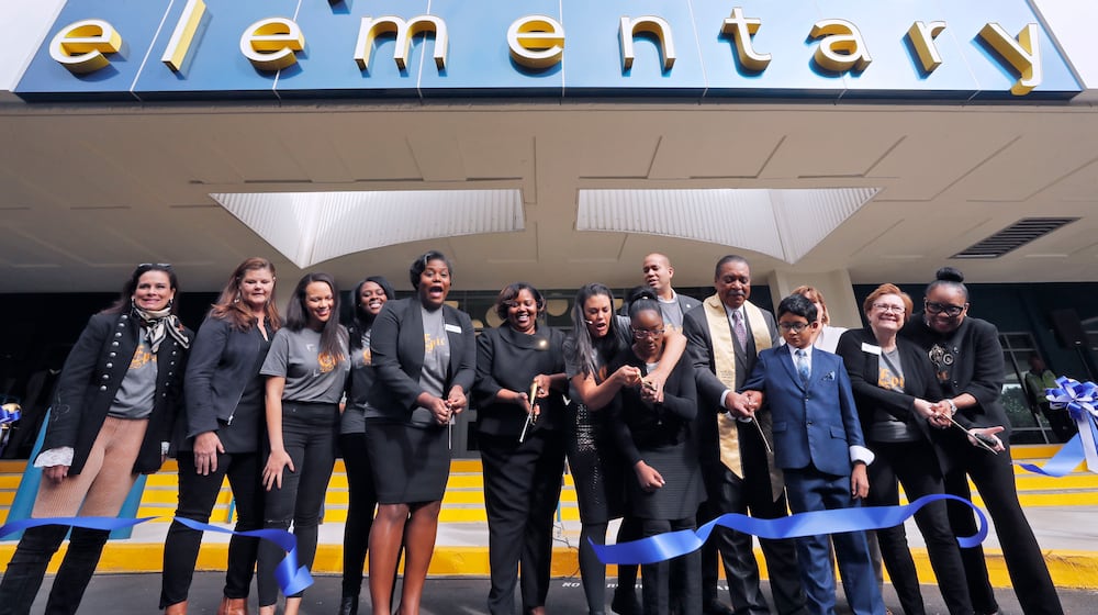 November 7, 2019 - Atlanta - Atlanta Public Schools Superintendent Meria Carstarphen (center), along with Harper Archer Principal, Dr. Dione Simon Taylor, school board menbers and students, held a ribbon cutting to celebrate the opening of the school. Carstarphen delivered her final State of the District address at the newly renovated Harper-Archer Elementary School. The theme of this year's address was"The Epic of APS." The program also included a ribbon cutting celebrating the opening of the newly renovated school. Bob Andres / robert.andres@ajc.com
