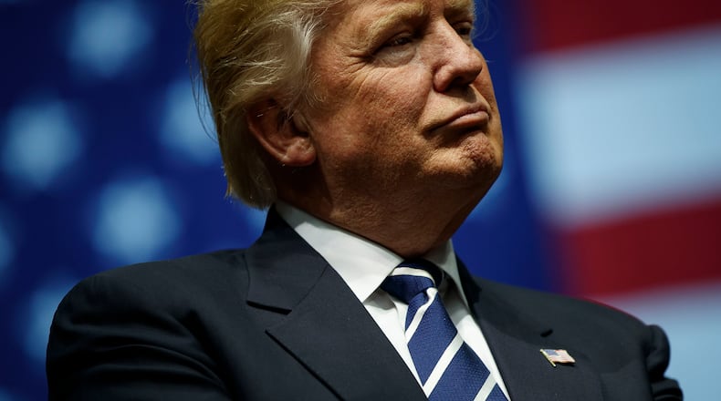 GRAND RAPIDS, MI - DECEMBER 9: President-elect Donald Trump looks on during at the DeltaPlex Arena, December 9, 2016 in Grand Rapids, Michigan, during his victory tour across the country. (Photo by Drew Angerer/Getty Images)