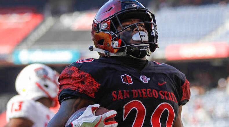 San Diego State running back Rashaad Penny carries the ball for a 51-yard touchdown run against New Mexico at SDCCU Stadium in San Diego on November 24, 2017. (Hayne Palmour IV/San Diego Union-Tribune/TNS)