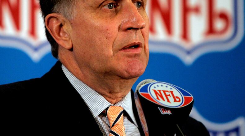 FILE - This May 23, 2006 file photo shows then NFL Commissioner Paul Tagliabue responding to questions during a news conference at the conclusion of the National Football League's owners spring meeting in Denver. (AP Photo/Ed Andrieski, File)