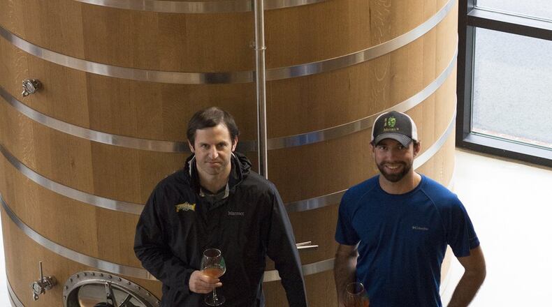 Mark Medlin, SweetWater Brewing Co. brewmaster (left), and Troy Montrone, the Woodlands barrel-aging manager. CONTRIBUTED BY TUCKER BERTA SARKISIAN