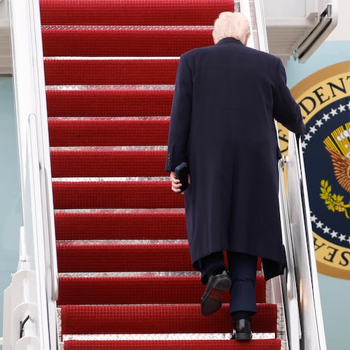 President Donald Trump walks up the stairs of Air Force One at Joint Base Andrews, Md., Friday, March 27, 2026. (AP Photo/Luis M. Alvarez)
