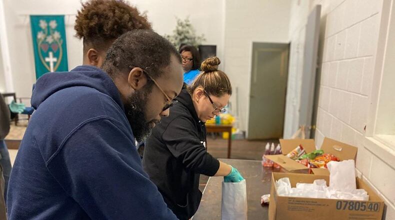 About 1,500 food boxes are needed to be packed by volunteers with donated goods for children out of school and parents out of work over the next two weeks due to the COVID-19 virus. (Courtesy of Cobb County School District)
