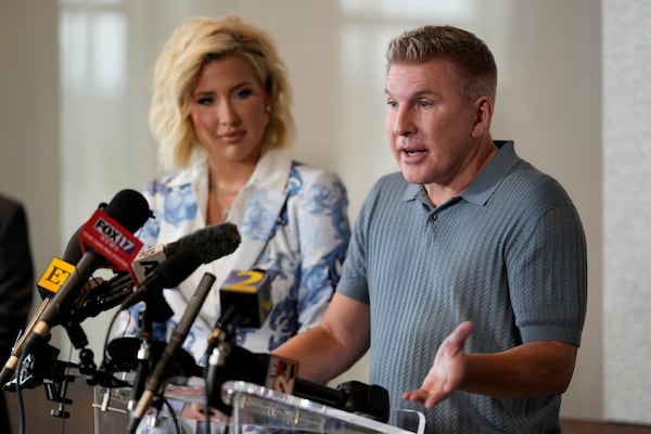 Reality television star Todd Chrisley speaks as his daughter Savannah Chrisley looks on during a news conference on Friday, May 30, 2025 in Nashville, Tenn. (AP Photo/George Walker IV)