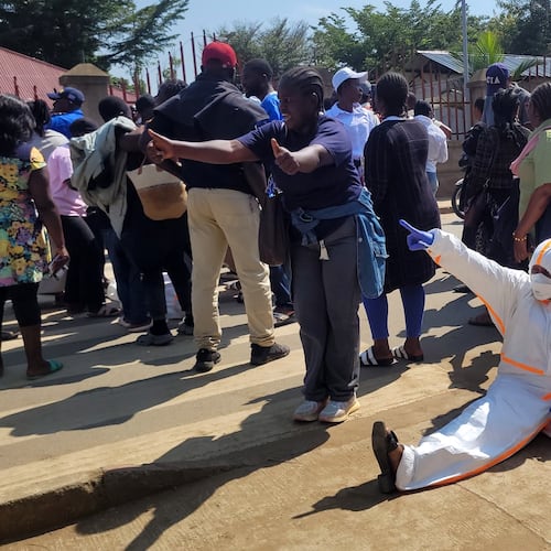 Health workers at the epicenter of Ebola outbreak protest over unpaid wages at the provincial governor's office in Ituri, eastern Congo, Thursday, Aug. 6, 2026. (AP Photo/Constant Same Bagalwa)