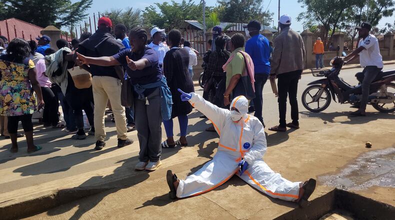 Health workers at the epicenter of Ebola outbreak protest over unpaid wages at the provincial governor's office in Ituri, eastern Congo, Thursday, Aug. 6, 2026. (AP Photo/Constant Same Bagalwa)