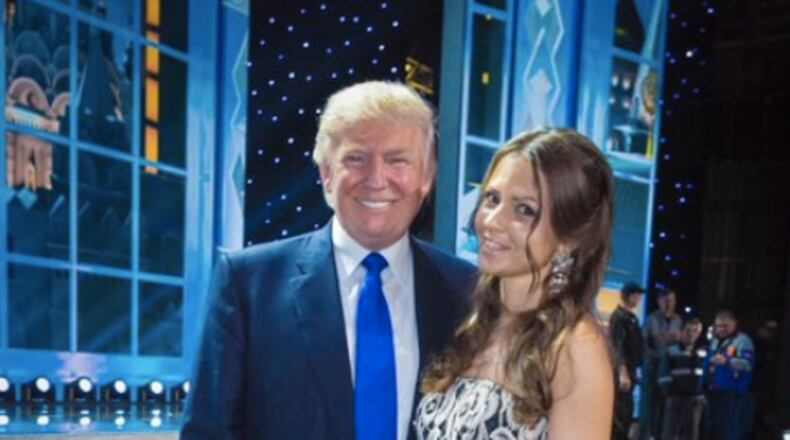 Yulya Alferova poses with Donald Trump at the Miss Universe pageant in Moscow in November 2013. (Twitter)