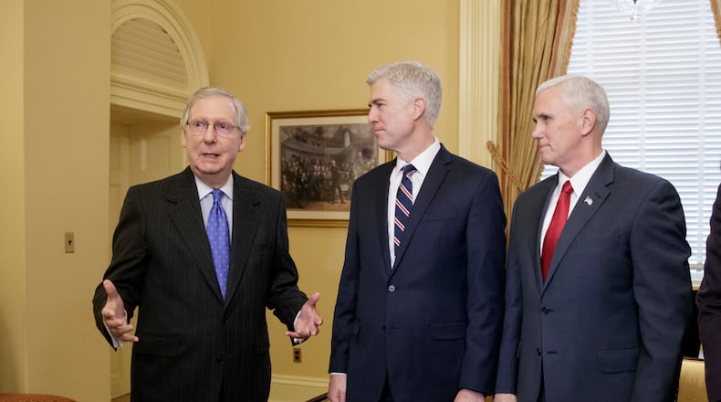 Supreme Court Justice nominee, Neil Gorsuch, center, is joined by Vice President Mike Pence, right, as they meet with Senate Majority Leader Mitch McConnell of Ky. on Capitol Hill in Washington, Wednesday, Feb. 1, 2017. Last year, Senate Republicans, led by McConnell, blocked a confirmation hearing for Judge Merrick Garland, President Barack Obama's pick for the vacancy left by the death of Justice Antonin Scalia who died in February 2016. (AP Photo/J. Scott Applewhite)