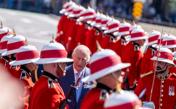 King Charles inspects an honor guard as he arrives in front of the Senate building in Ottawa, Canada, on Tuesday, May 27, 2025. (Christinne Muschi/The Canadian Press via AP)