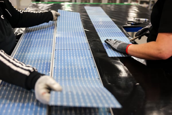 Workers learn how to fix solar panels at the Qcells solar factory in White on June 8, 2026. (Arvin Temkar/AJC)