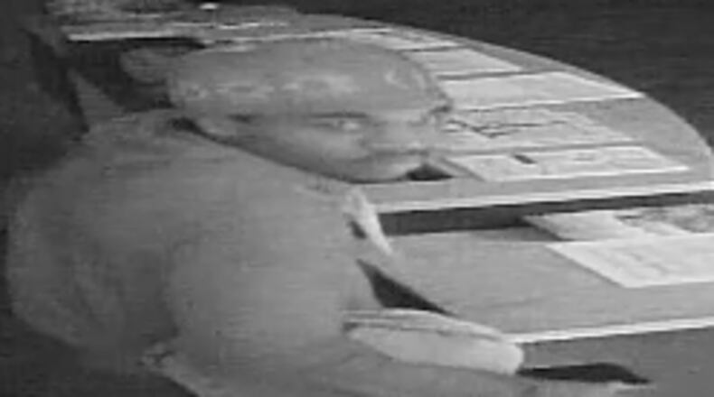 This man was captured in surveillance photos at a church in Farburn during a burglary, police said.