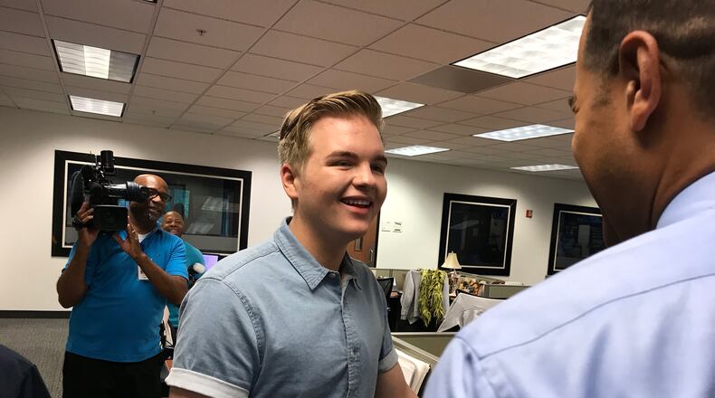 Fred Blankeship of Channel 2 Action News interviews Caleb Lee Hutchinson, who visited the WSB building Tuesday morning as part of his 'American Idol" hometown visit. CREDIT: Rodney Ho/rho@ajc.com