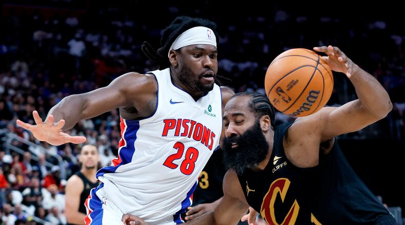 Cleveland Cavaliers guard James Harden (1) drives against Detroit Pistons forward Isaiah Stewart (28) during the first half in Game 1 of a second-round NBA playoffs basketball series Tuesday, May 5, 2026, in Detroit. (AP Photo/Duane Burleson)